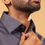 Half side collar view of steel grey Giza satin shirt on model