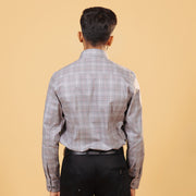 Model back view wearing light brown Giza twill check shirt