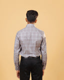 Model back view wearing light brown Giza twill check shirt