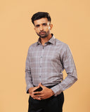 Model wearing light brown Giza twill check shirt front view