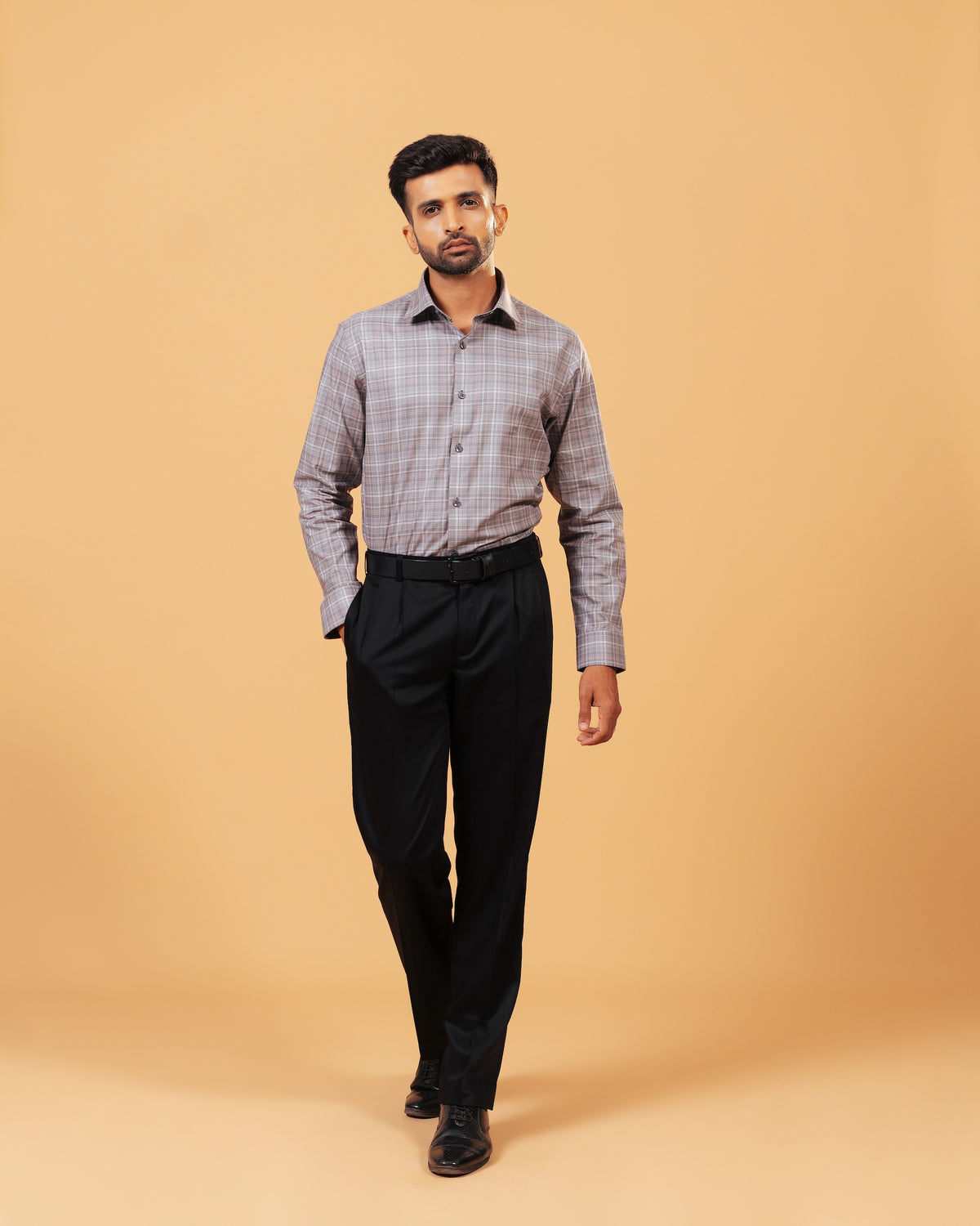 Model wearing light brown Giza twill check shirt full front view
