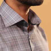Half side collar view of light brown Giza twill check shirt on model