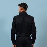 Model back view wearing black twill shirt