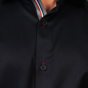 Model wearing black twill shirt full front zoomed placket view