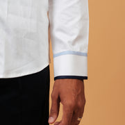 Zoomed cuff detail of white Giza satin shirt on model