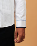 Zoomed cuff detail of white Giza satin shirt on model