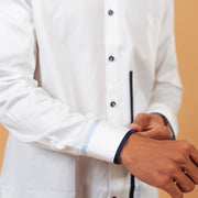 Folded cuff detail of white Giza satin shirt on model