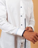 Folded cuff detail of white Giza satin shirt on model