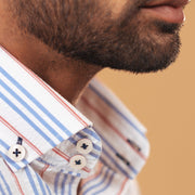 Half side collar view of white seersucker striped shirt on model