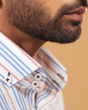 Half side collar view of white seersucker striped shirt on model