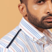 Shoulder view of white seersucker striped shirt on model