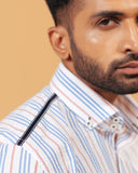 Shoulder view of white seersucker striped shirt on model